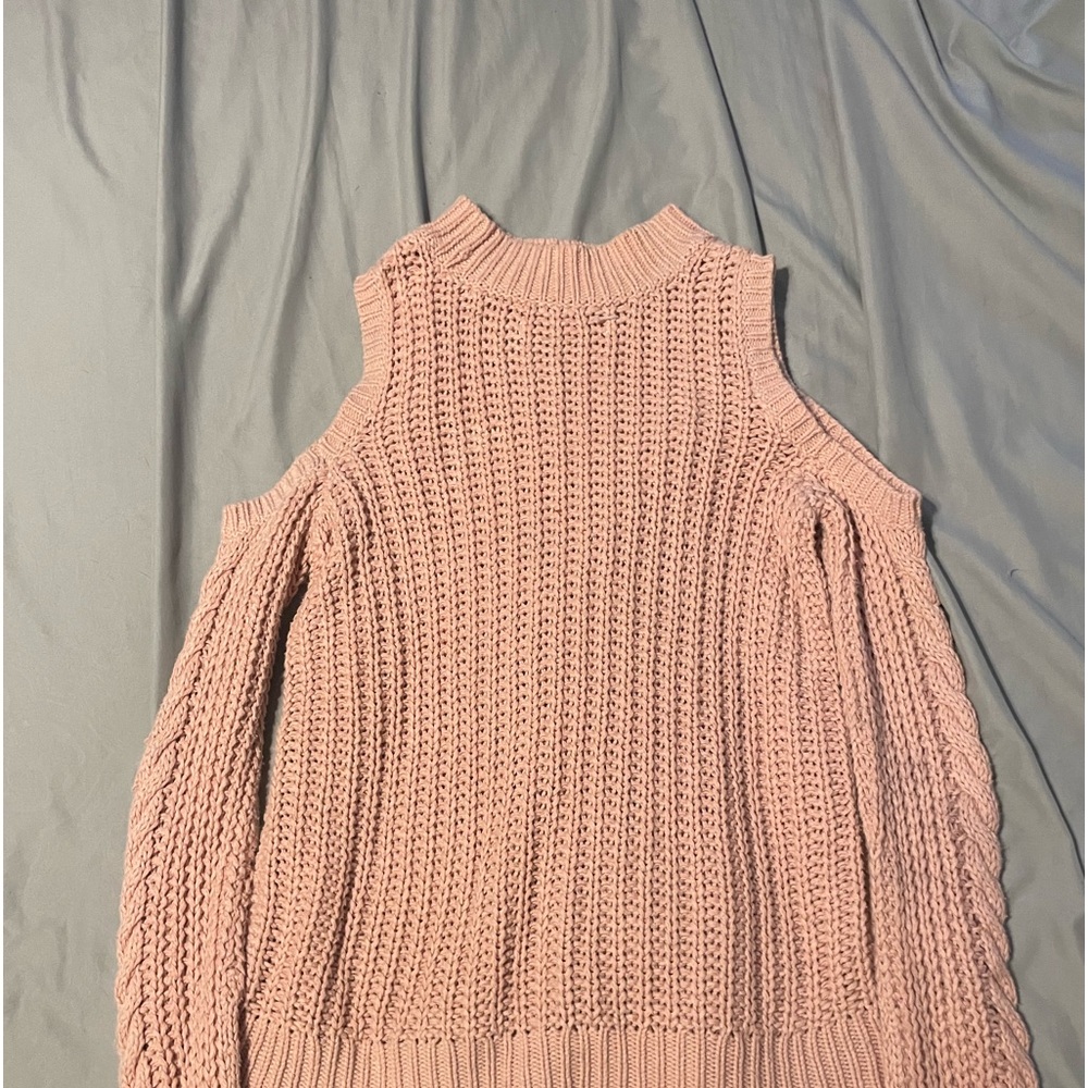 It’s a baby pink sweater